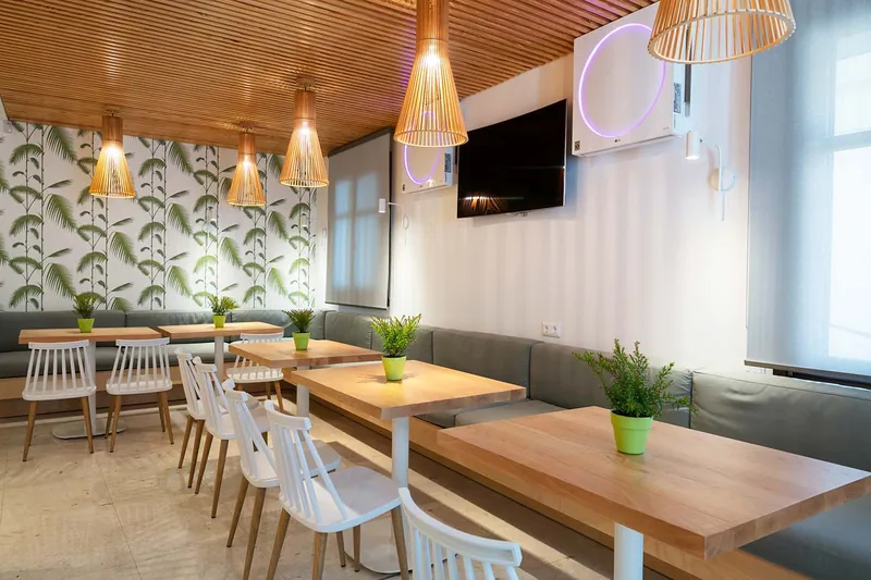The lounge with its palm-leaf wallpaper